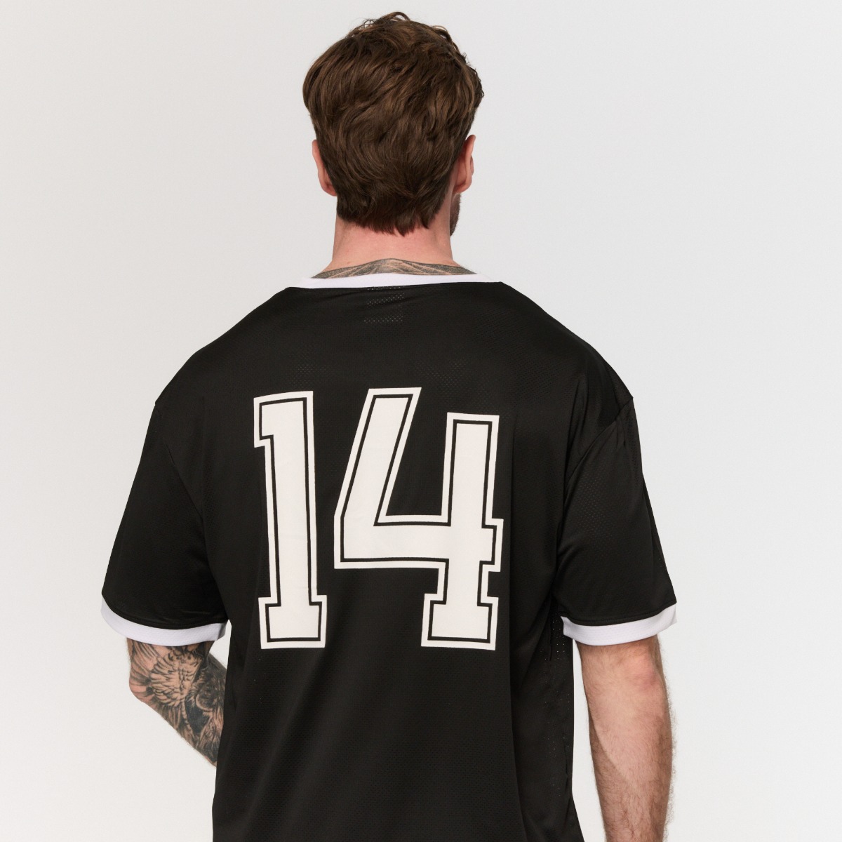 T-shirt ample style varsity, couleur noire - GymBeam.