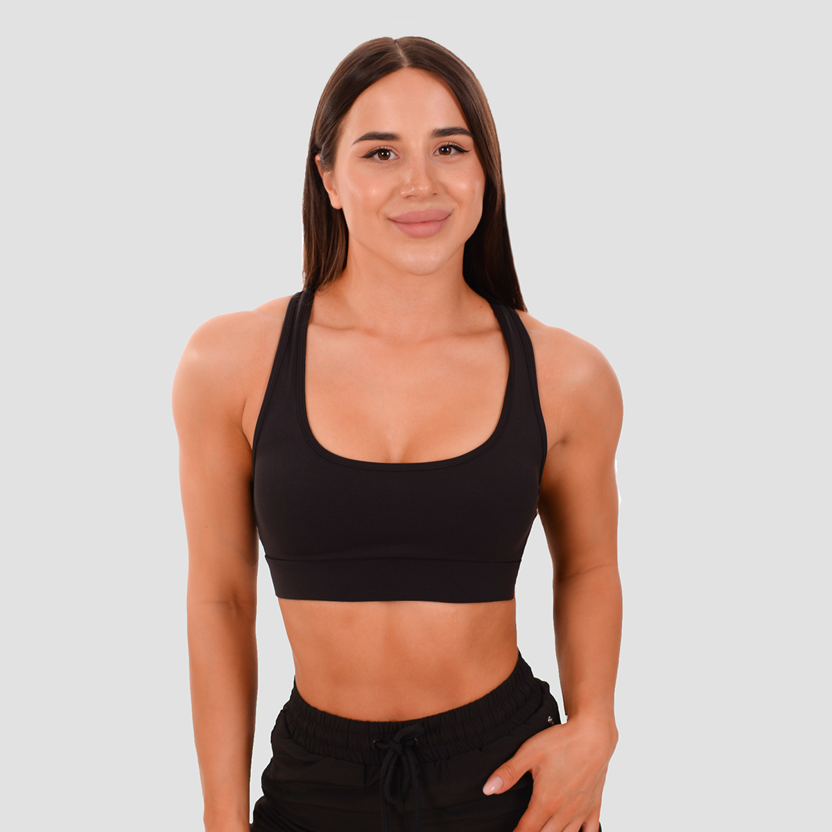 Brassière de sport à panneaux en mesh, couleur noire - GymBeam.